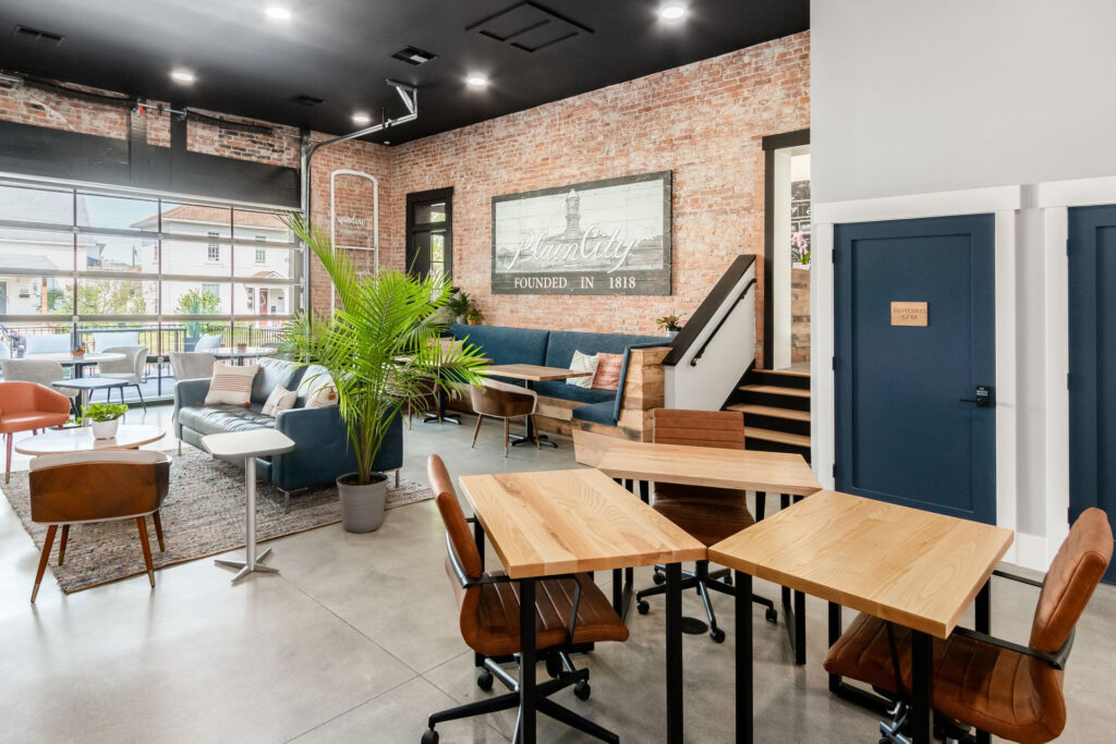 Bright and modern coworking space with ergonomic furniture, natural light, and a welcoming communal area